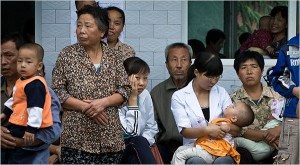 Villagers waited with their children on Tuesday for blood tests at a school in Shaanxi province, in north-central China, where 851 children living near the nation's fourth-largest smelter have tested positive for lead poisoning since early August.