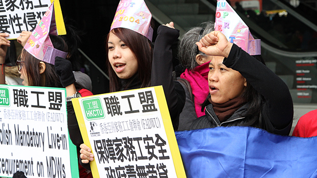 Foreign domestic workers in Hong Kong hold a rally on Sunday, March 3, calling for abolishment of the rule requiring them to live with their employers.