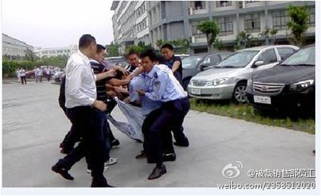 BYD protesters rounded up by many security guards