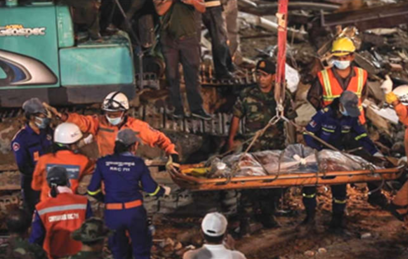 Rescue teams pull out victims from the rubble.